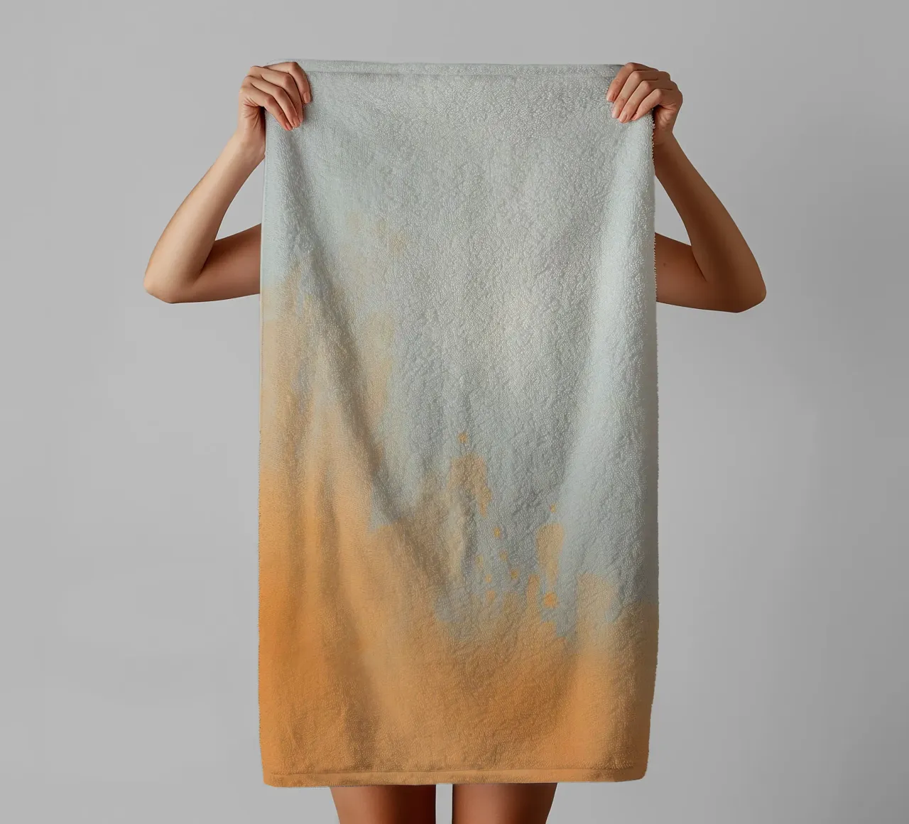 Abstract design featuring soft orange hues and gray tones towel by DesignDoodle