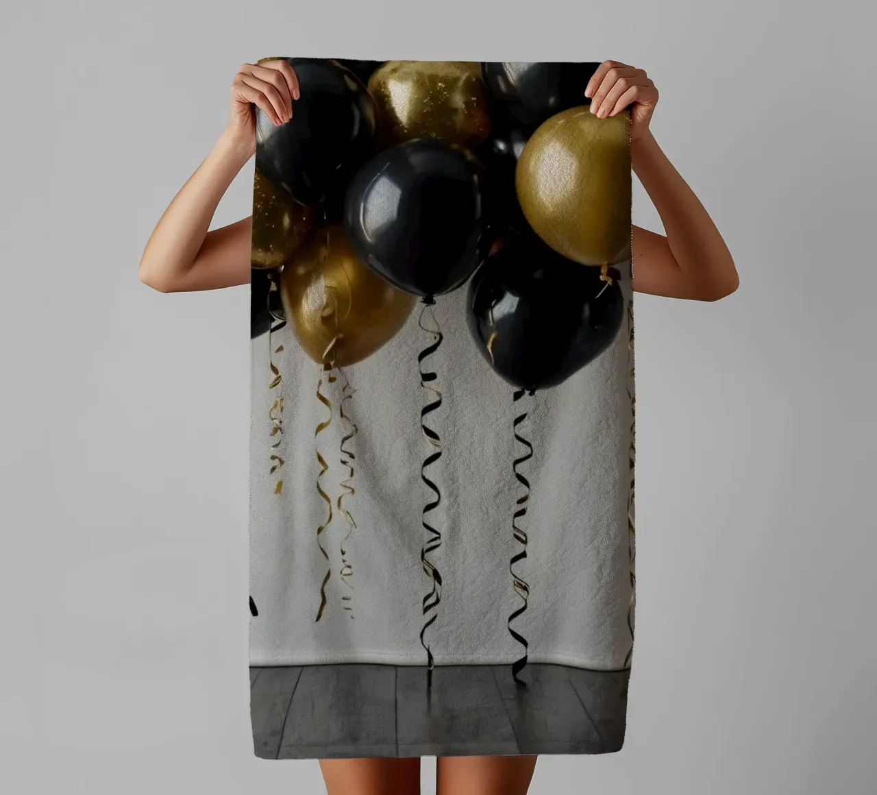 Celebration backdrop featuring black and gold balloons towel by DesignDoodle
