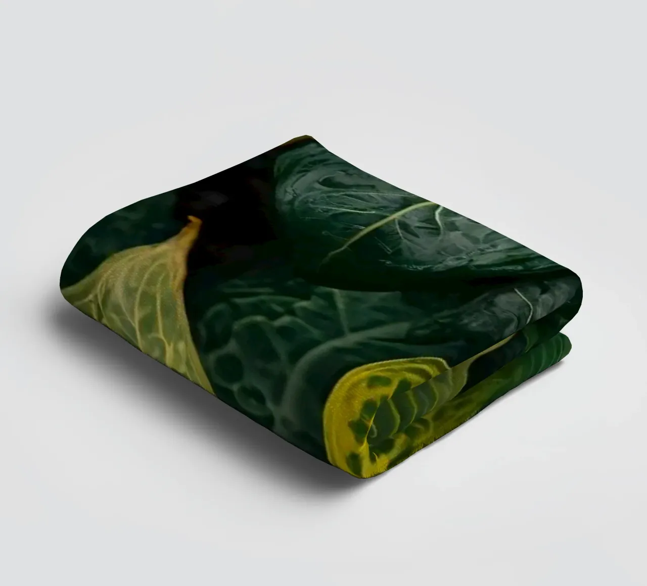 Lush green leaves with intricate textures and vibrant hues towel by DesignDoodle