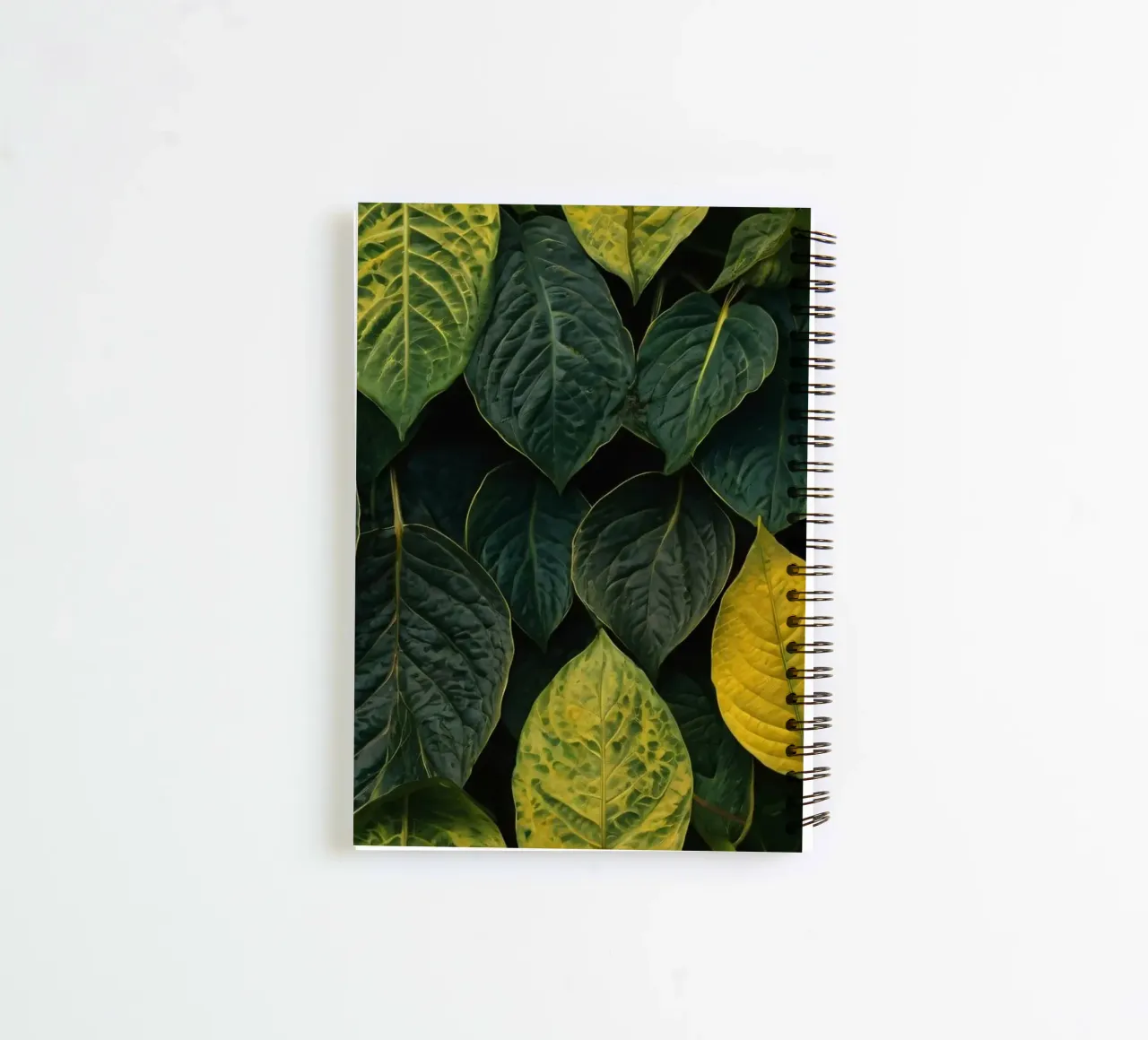 Lush green and yellow leaves create a vibrant abstract wallp spiral notebook by DesignDoodle