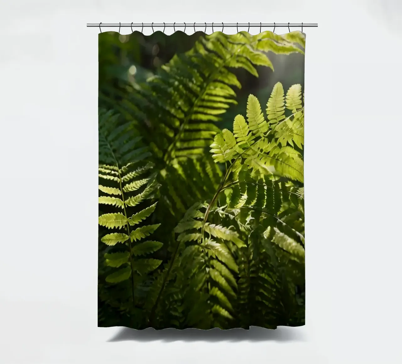 Lush green ferns basking in soft sunlight in a serene forest shower curtain by DesignDoodle