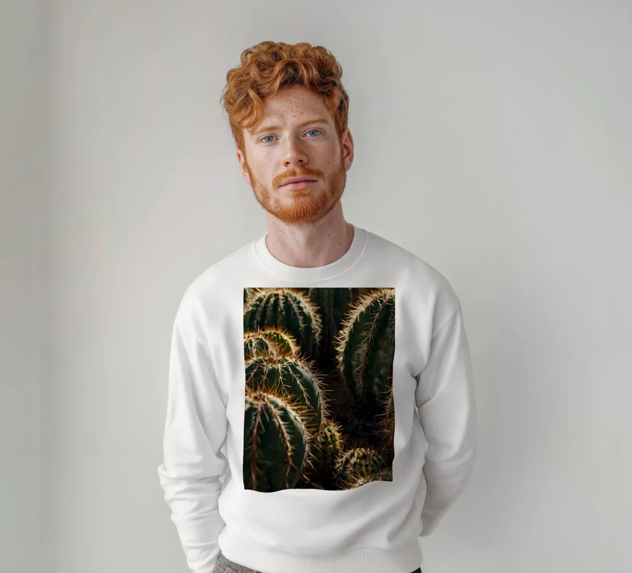 Close-up view of vibrant cacti with prominent spines sweatshirt by DesignDoodle