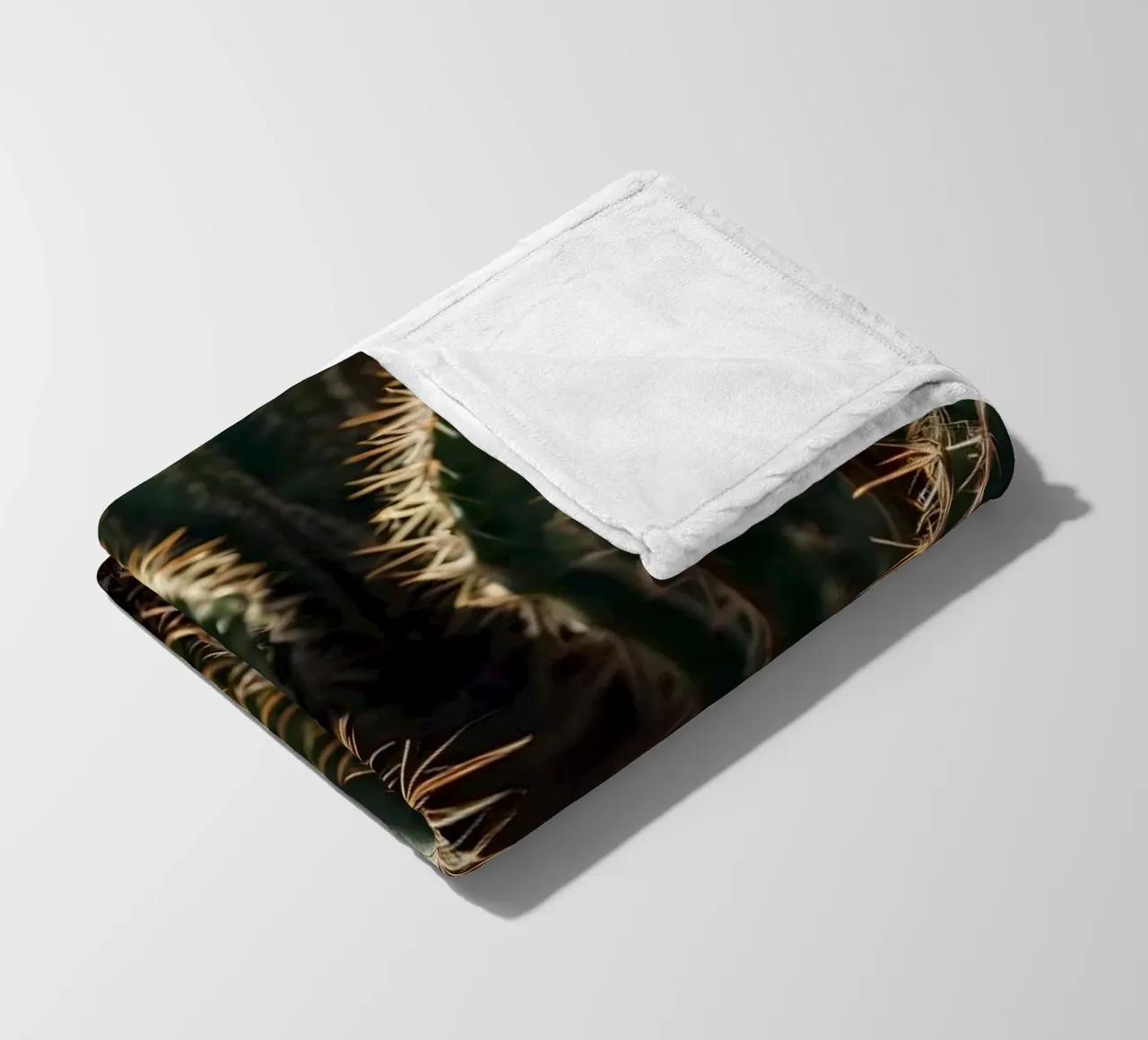 Close-up view of vibrant cacti with prominent spines fleece blanket by DesignDoodle