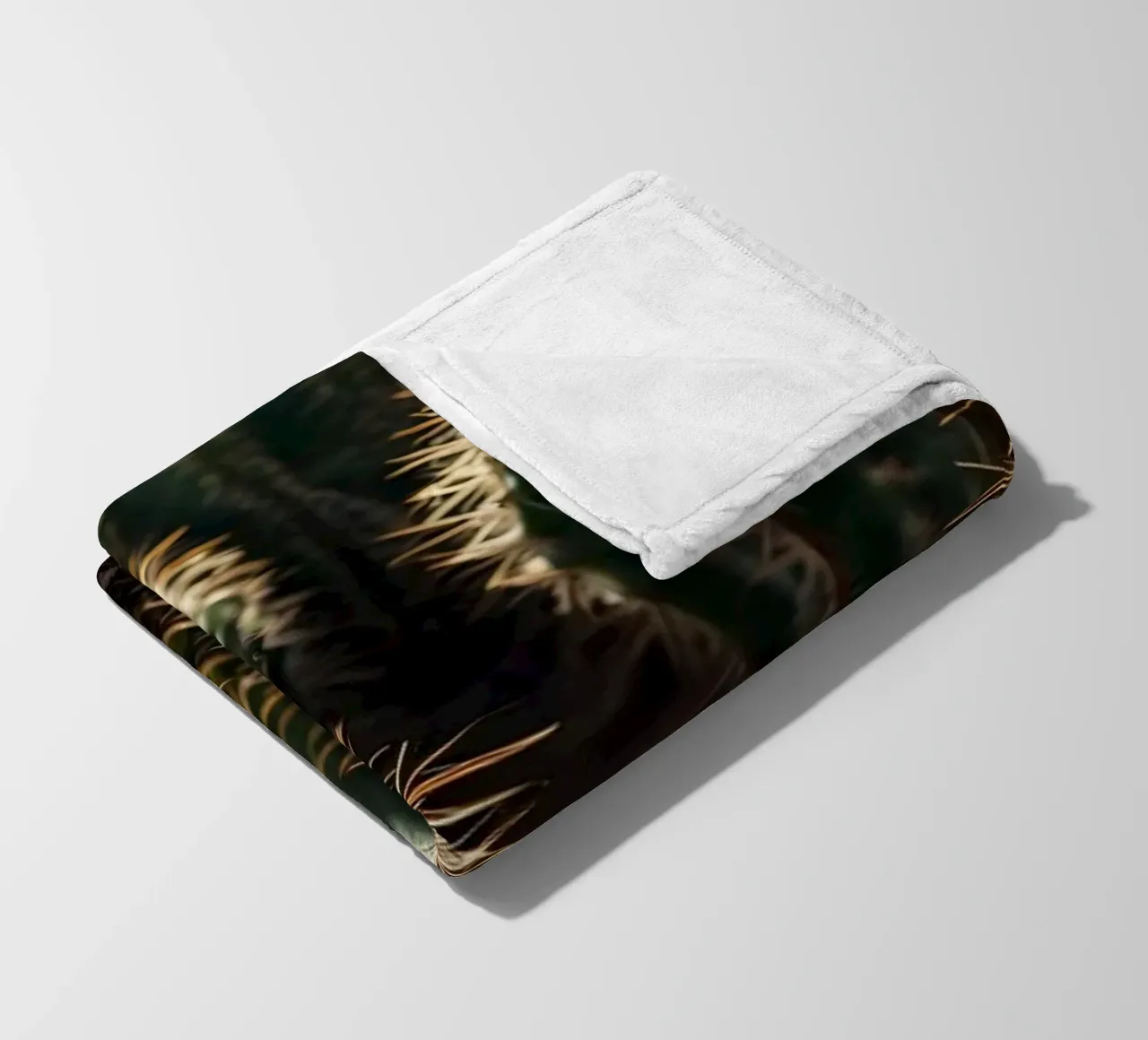Close-up view of vibrant cacti with prominent spines fleece blanket by DesignDoodle