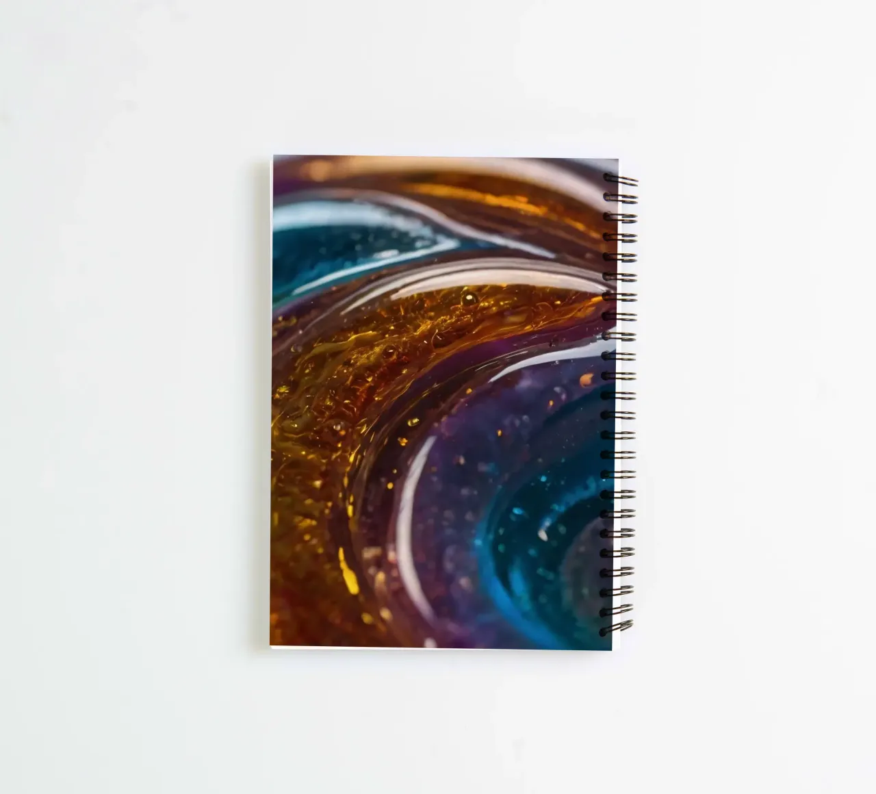 Swirling colors and textures in a close-up view of spiral notebook by DesignDoodle