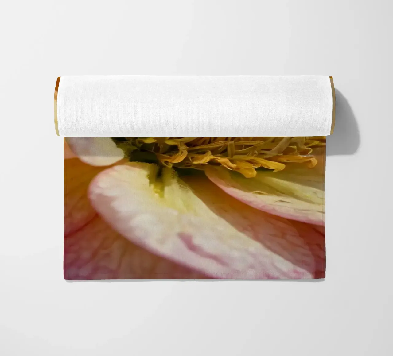 A close-up view of a vibrant flower in a garden beach towel by DesignDoodle