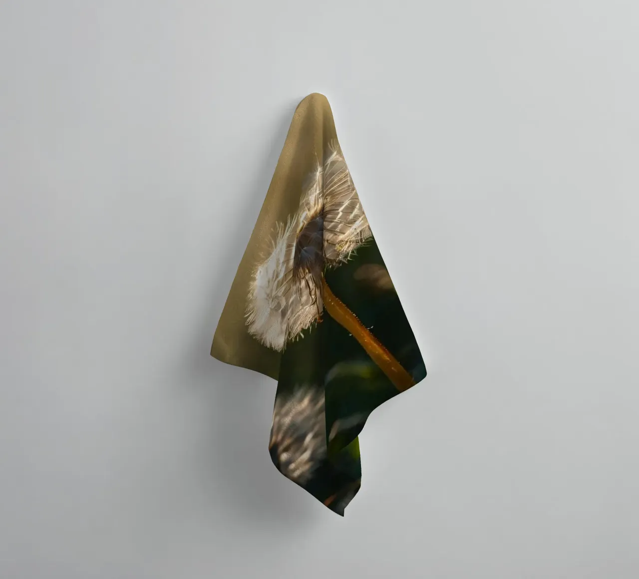 Dandelions illuminated by sunlight in a lush green field towel by DesignDoodle