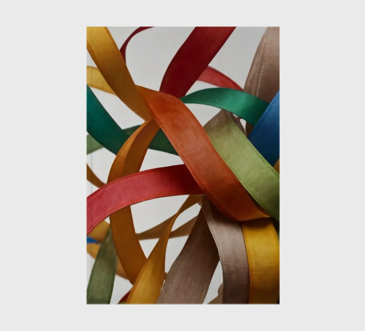 Colorful ribbons intertwined together create a vibrant displ notebook by DesignDoodle