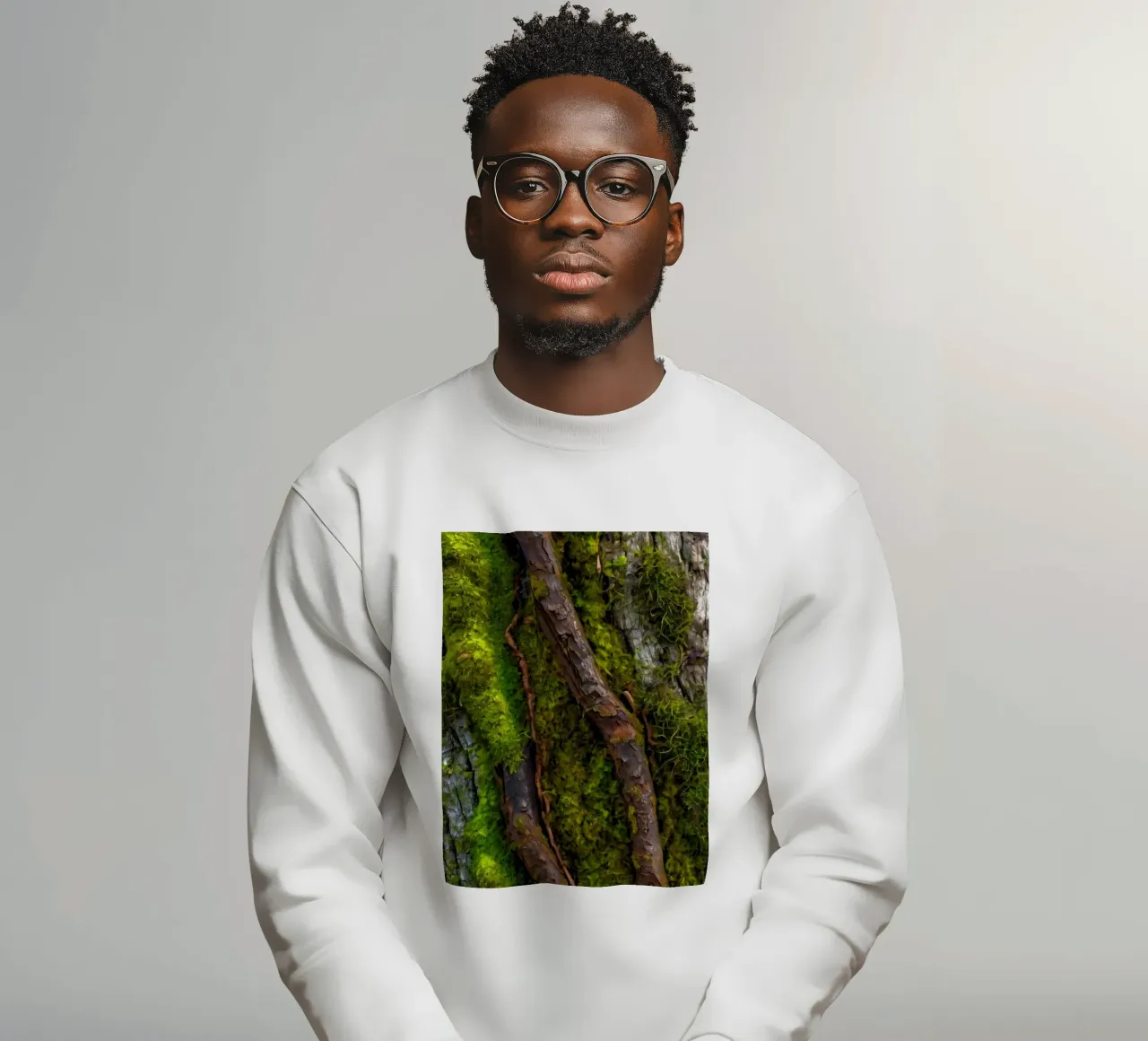 Moss-covered tree bark with twisting branches in a forest sweatshirt by DesignDoodle