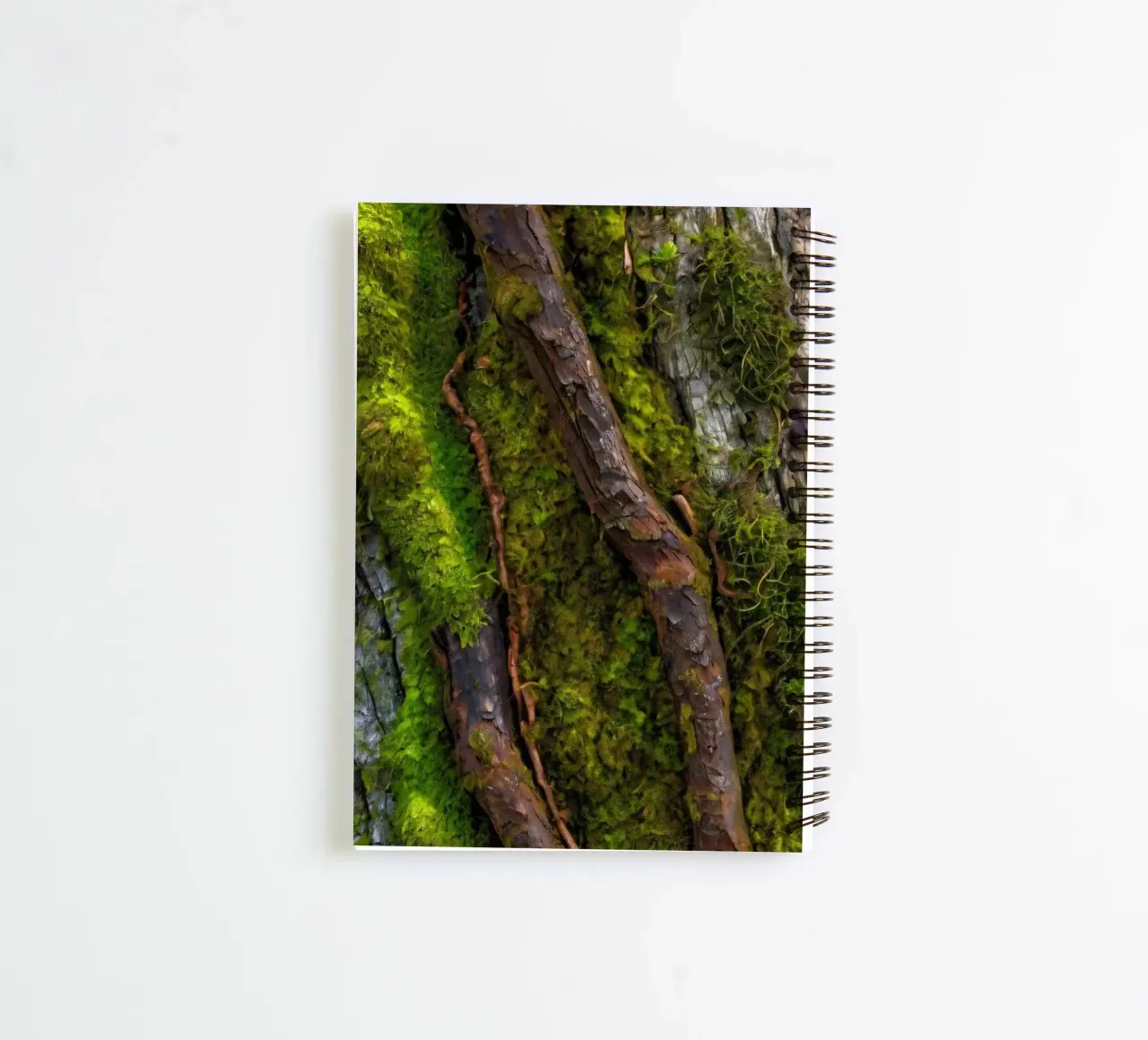 Moss-covered tree bark with twisting branches in a forest spiral notebook by DesignDoodle