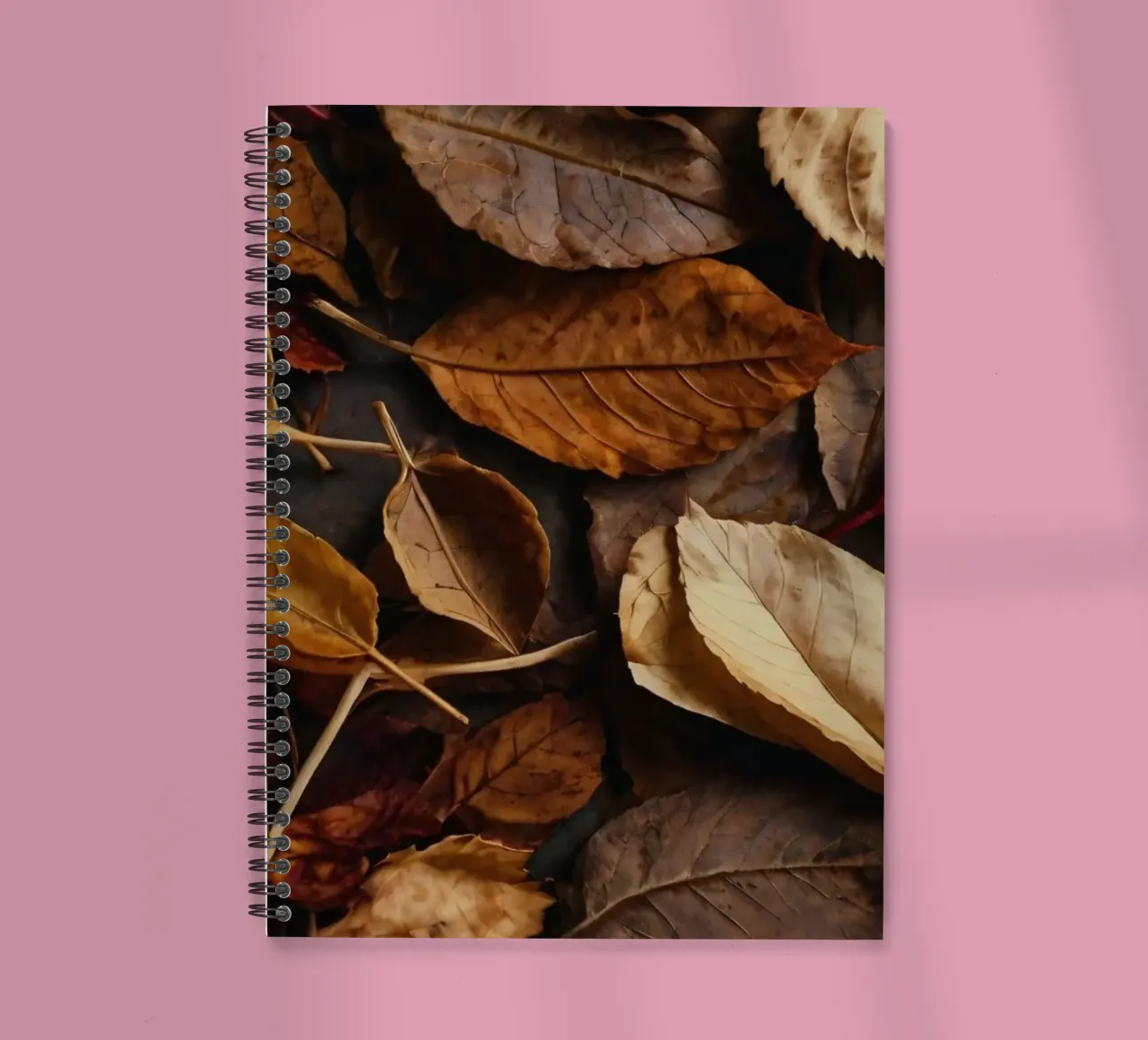 autumn leaves in various shades spread across a dark surface spiral notebook by DesignDoodle