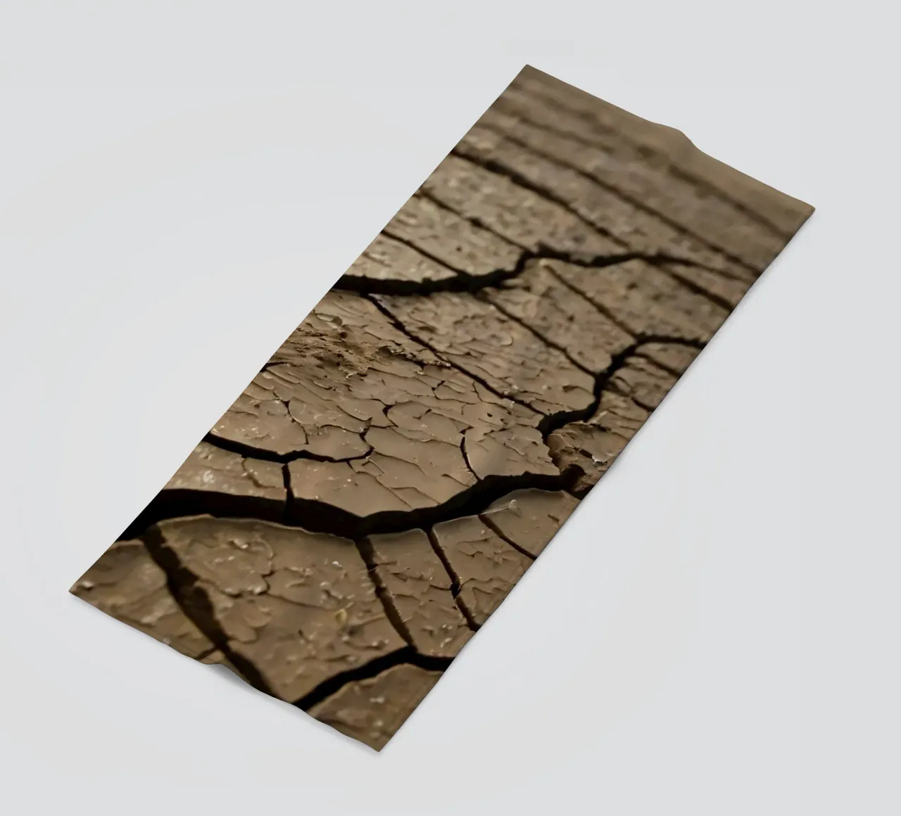 Cracked earth in barren landscape highlighting severe drout beach towel by DesignDoodle