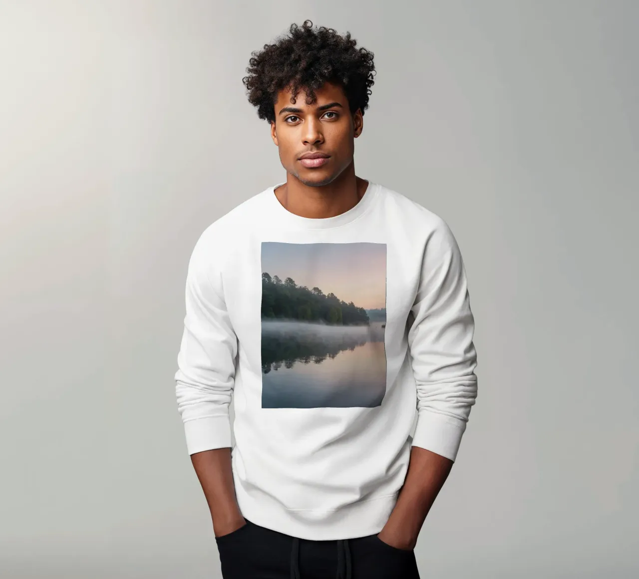mist rises over a tranquil lake surrounded by lush trees sweatshirt by DesignDoodle