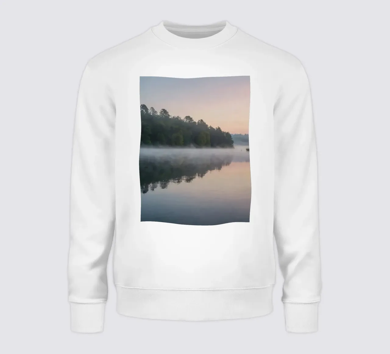 mist rises over a tranquil lake surrounded by lush trees sweatshirt by DesignDoodle