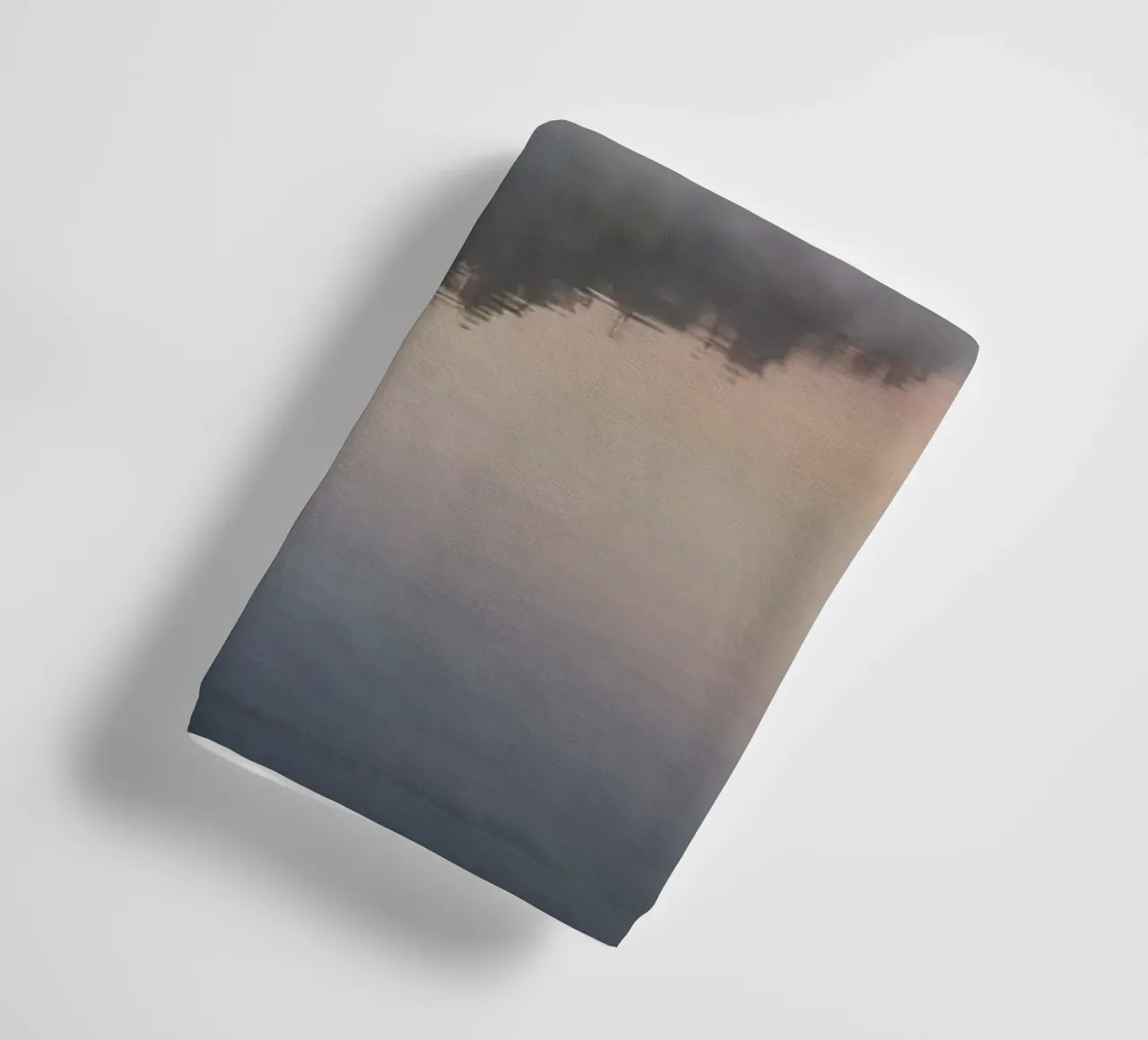 mist rises over a tranquil lake surrounded by lush trees towel by DesignDoodle