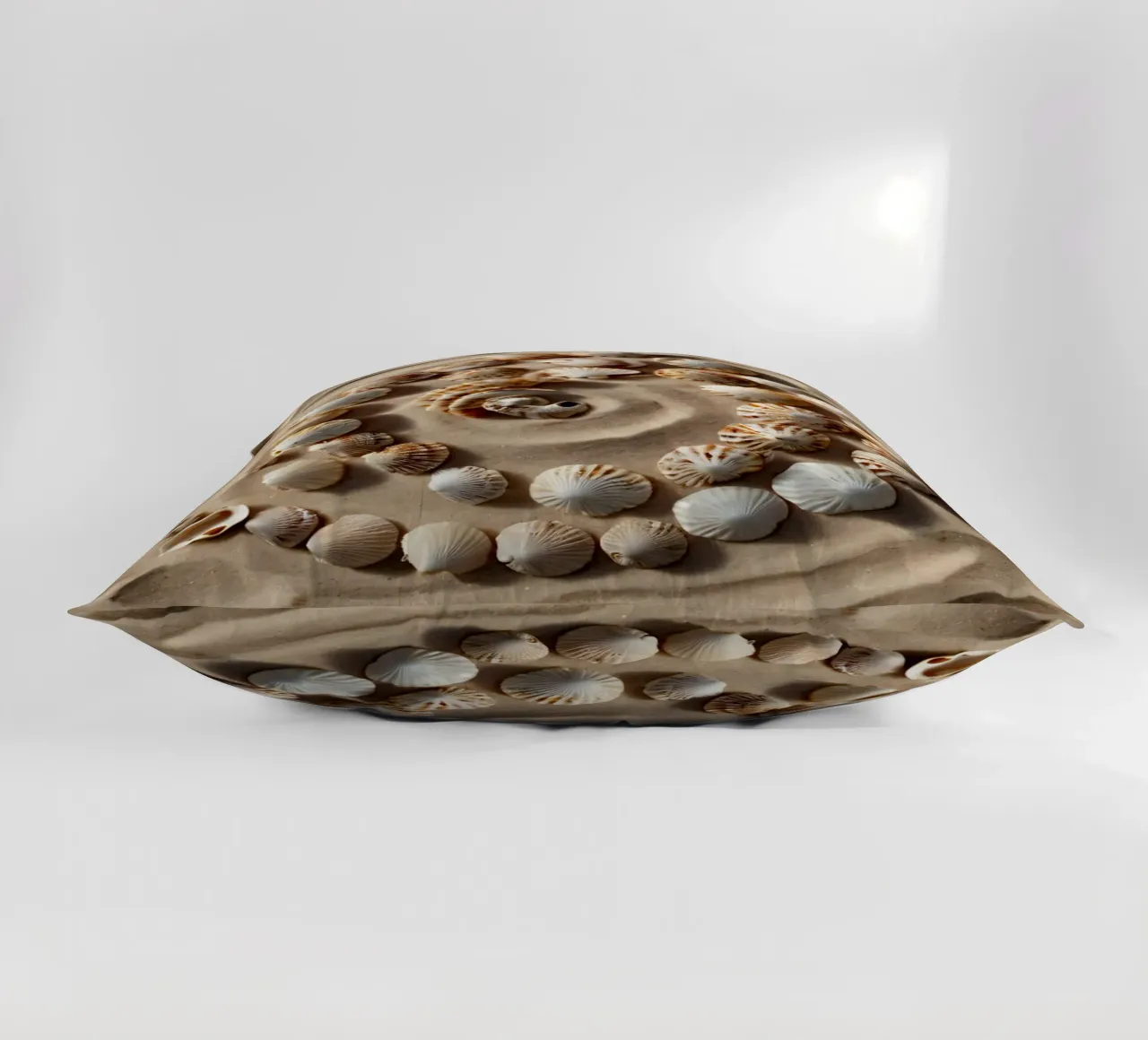 Natural spiral pattern created with seashells arranged decorative cushion by DesignDoodle
