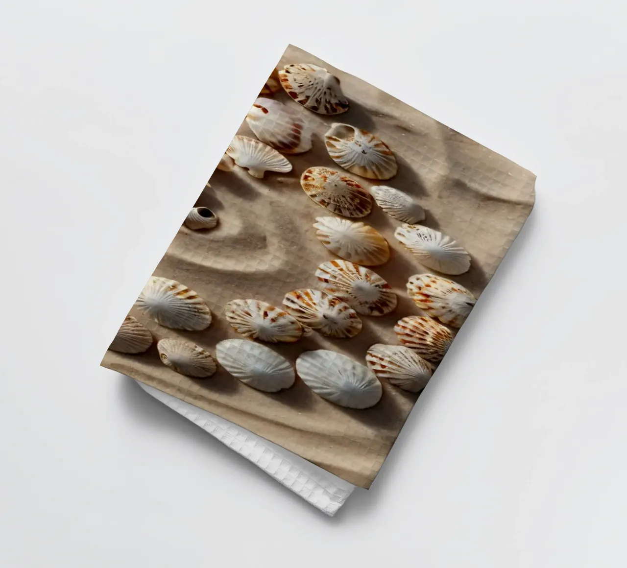 Natural spiral pattern created with seashells arranged tea towel by DesignDoodle