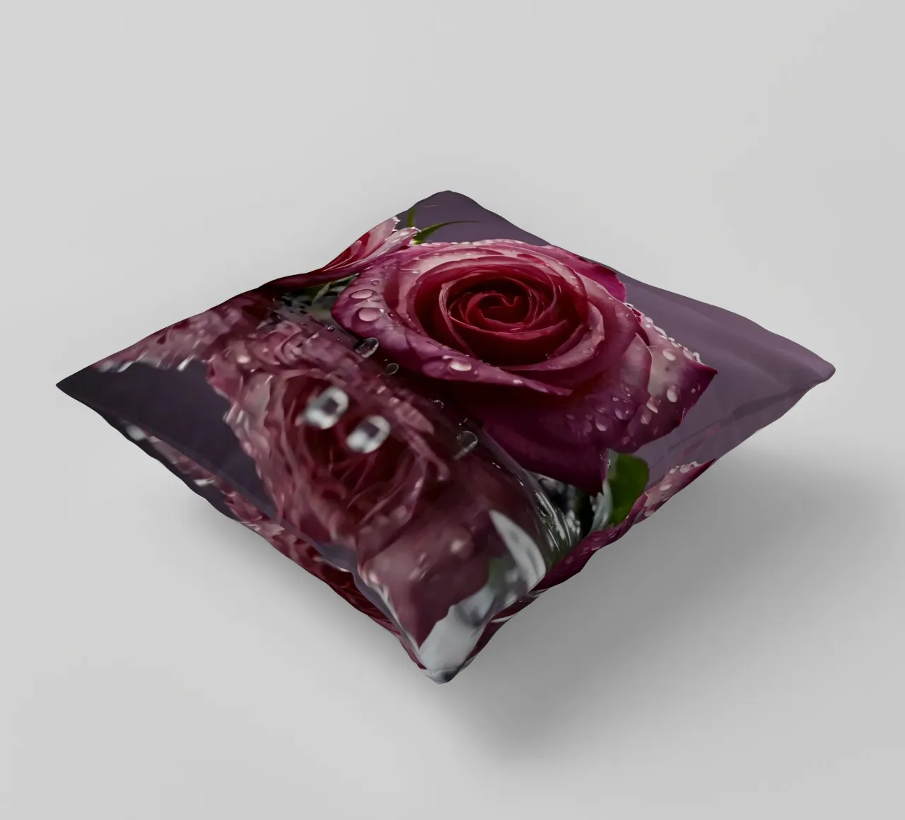 Due rose rosa baciate dalla rugiada appoggiate su una superficie riflettente cuscino da DesignDoodle