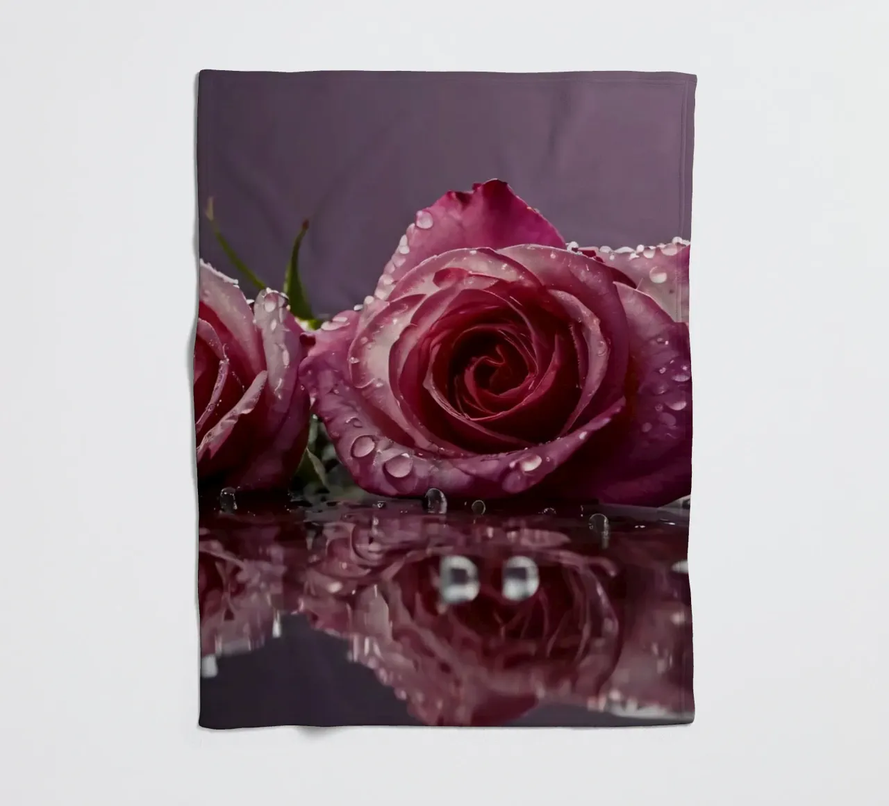 Two dew-kissed pink roses resting on a reflective surface fleece blanket by DesignDoodle