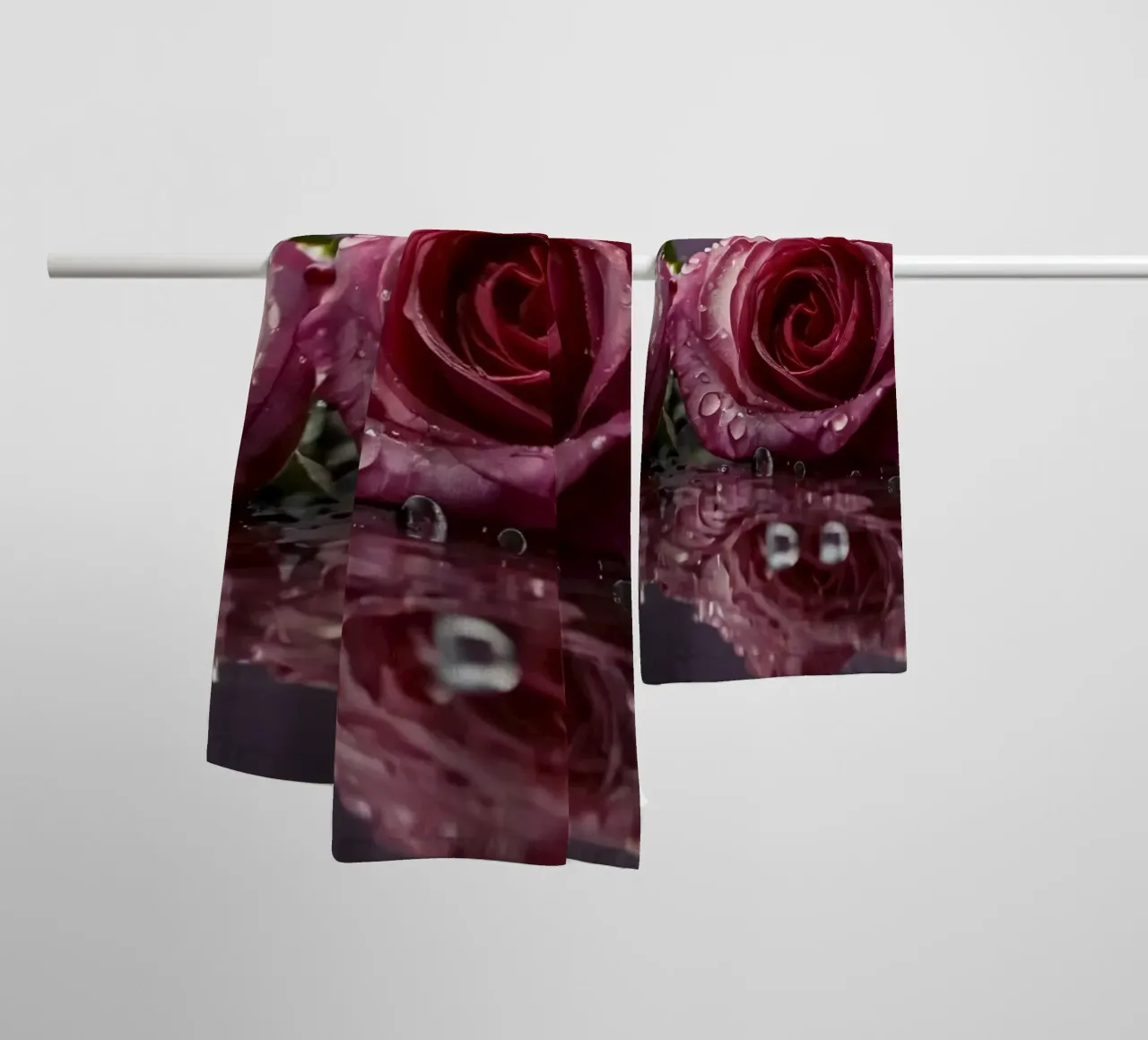 Two dew-kissed pink roses resting on a reflective surface towel by DesignDoodle