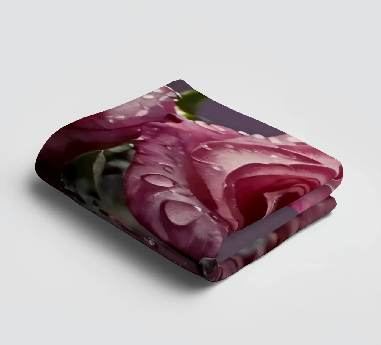 Two dew-kissed pink roses resting on a reflective surface towel by DesignDoodle