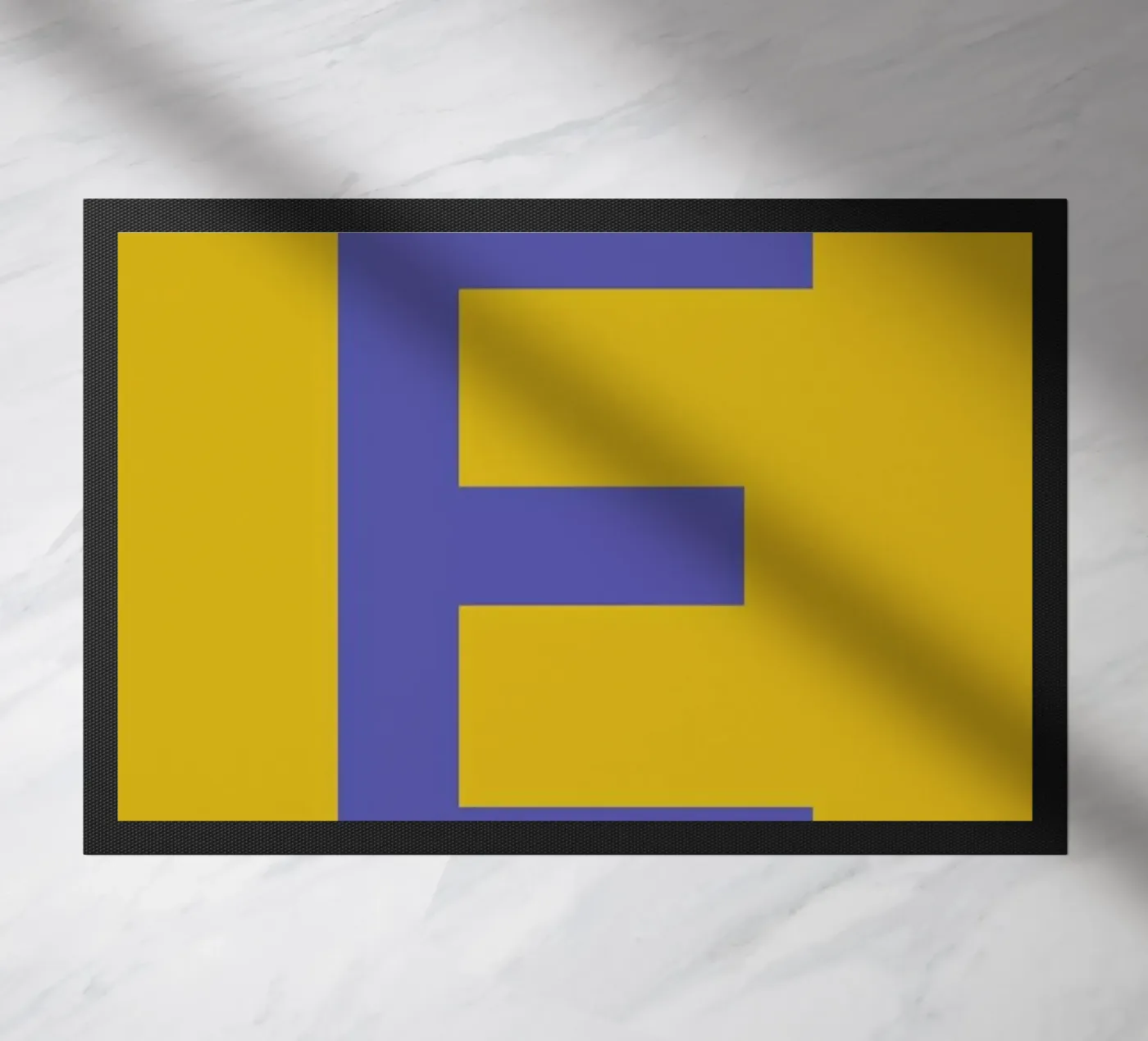 Yellow Letter E doormat by Studio One