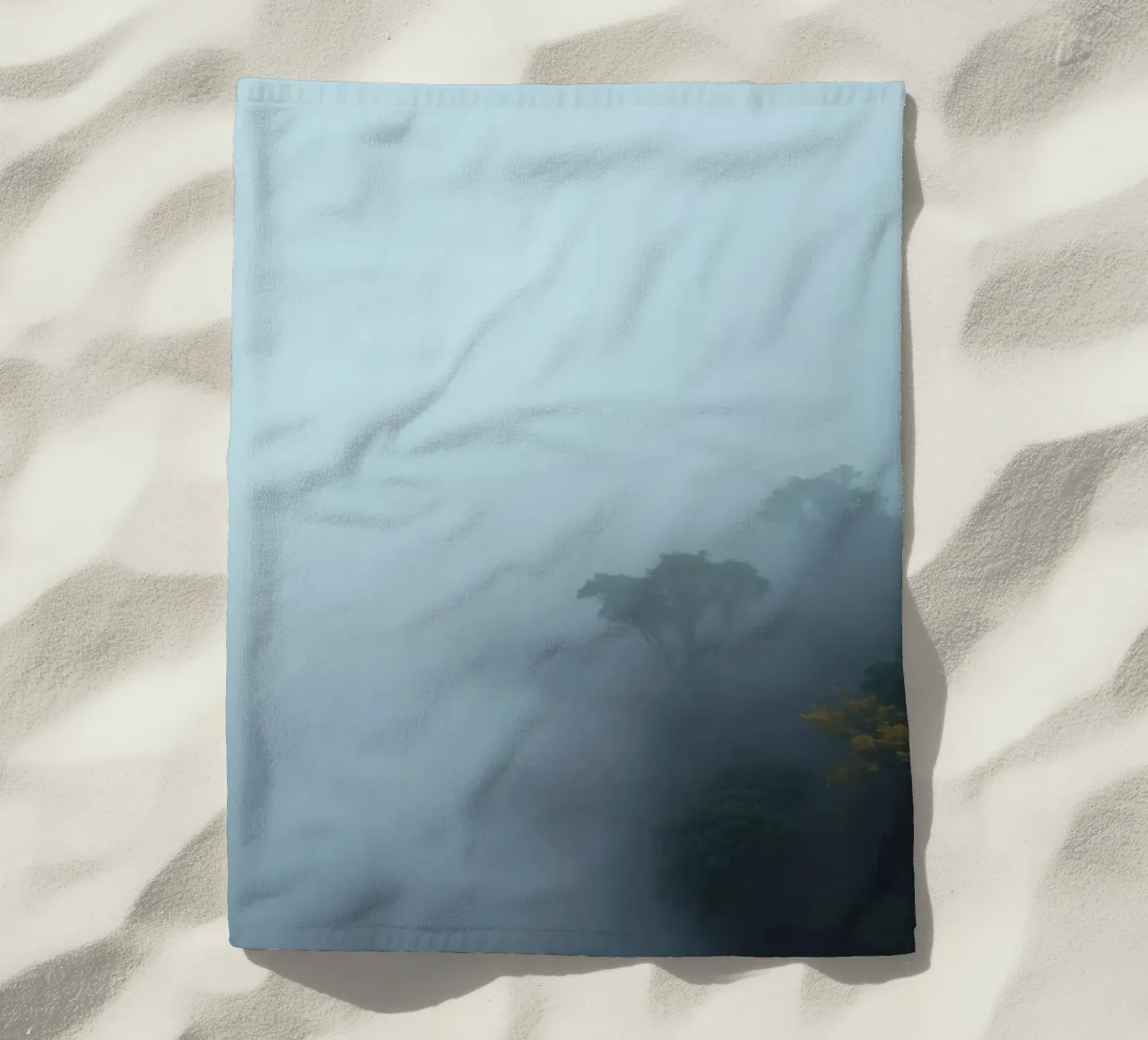 Misty forest landscape with trees emerging through fog beach towel by DesignDoodle