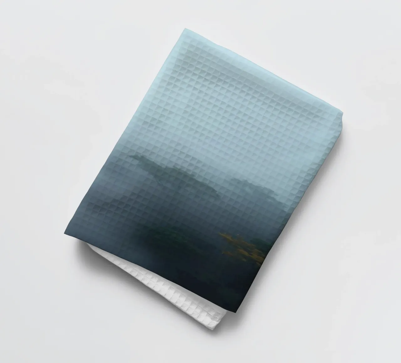 Misty forest landscape with trees emerging through fog tea towel by DesignDoodle