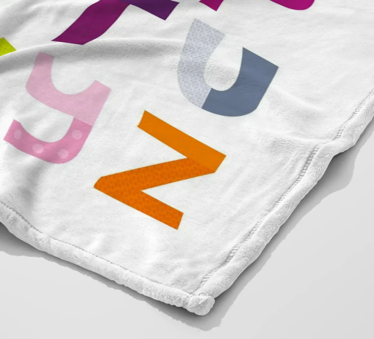 Colourful Alphabet fleece blanket by JaySan Studio
