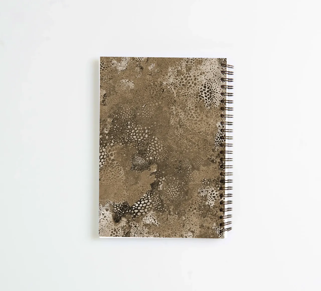 brown skin spiral notebook by Giulio Iurissevich