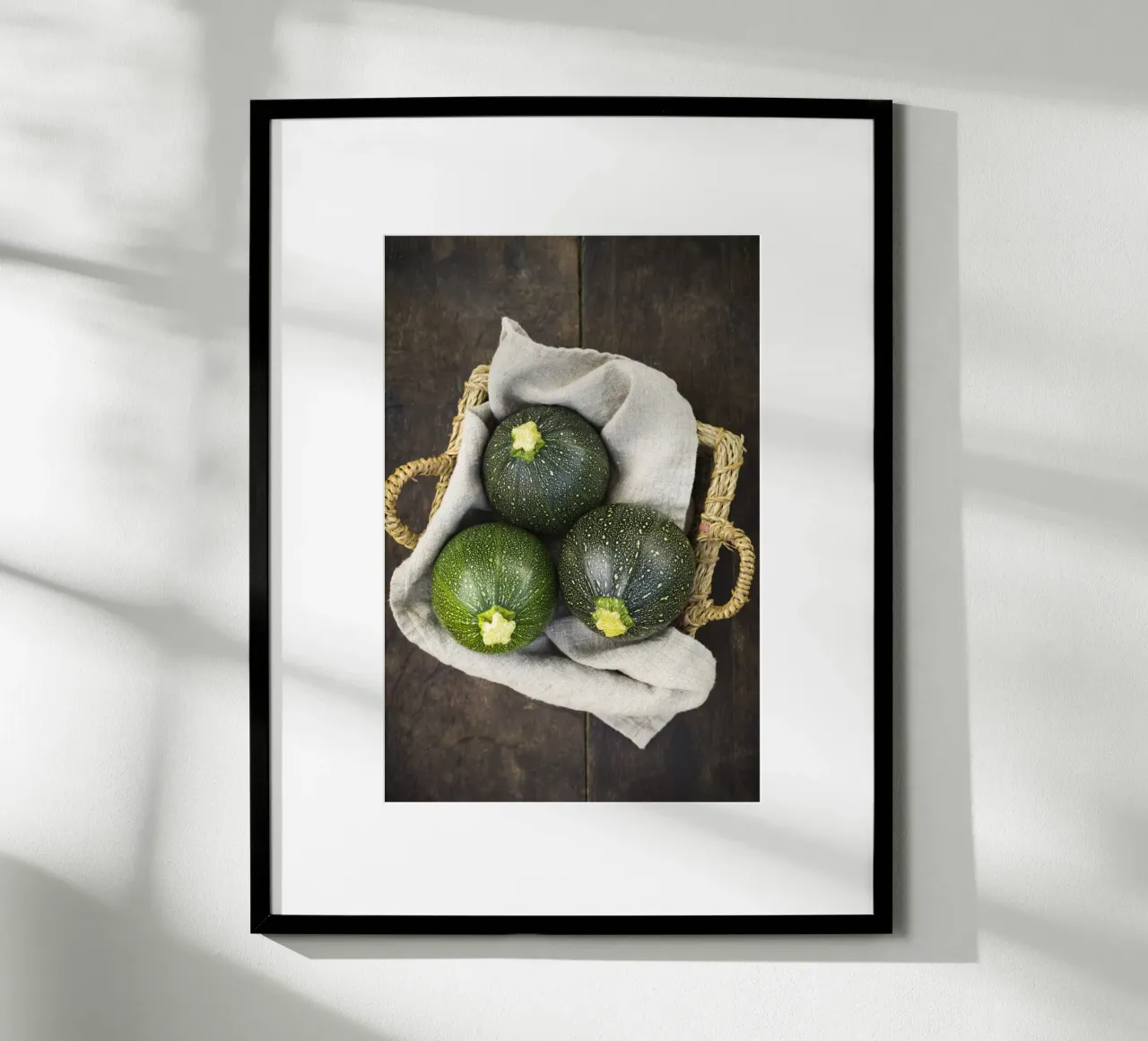 Round courgettes in a wicker basket poster by foodphotolove