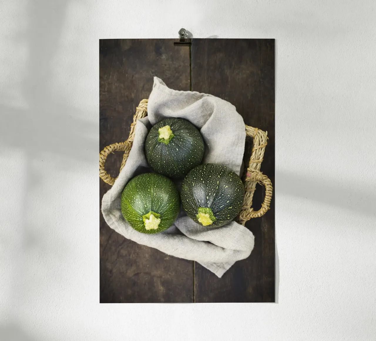 Round courgettes in a wicker basket poster by foodphotolove