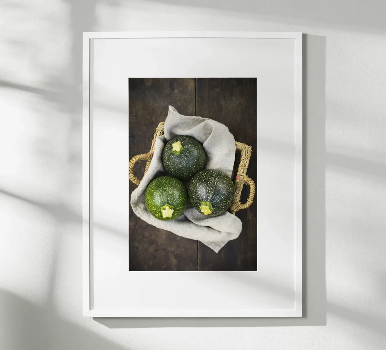 Round courgettes in a wicker basket poster by foodphotolove
