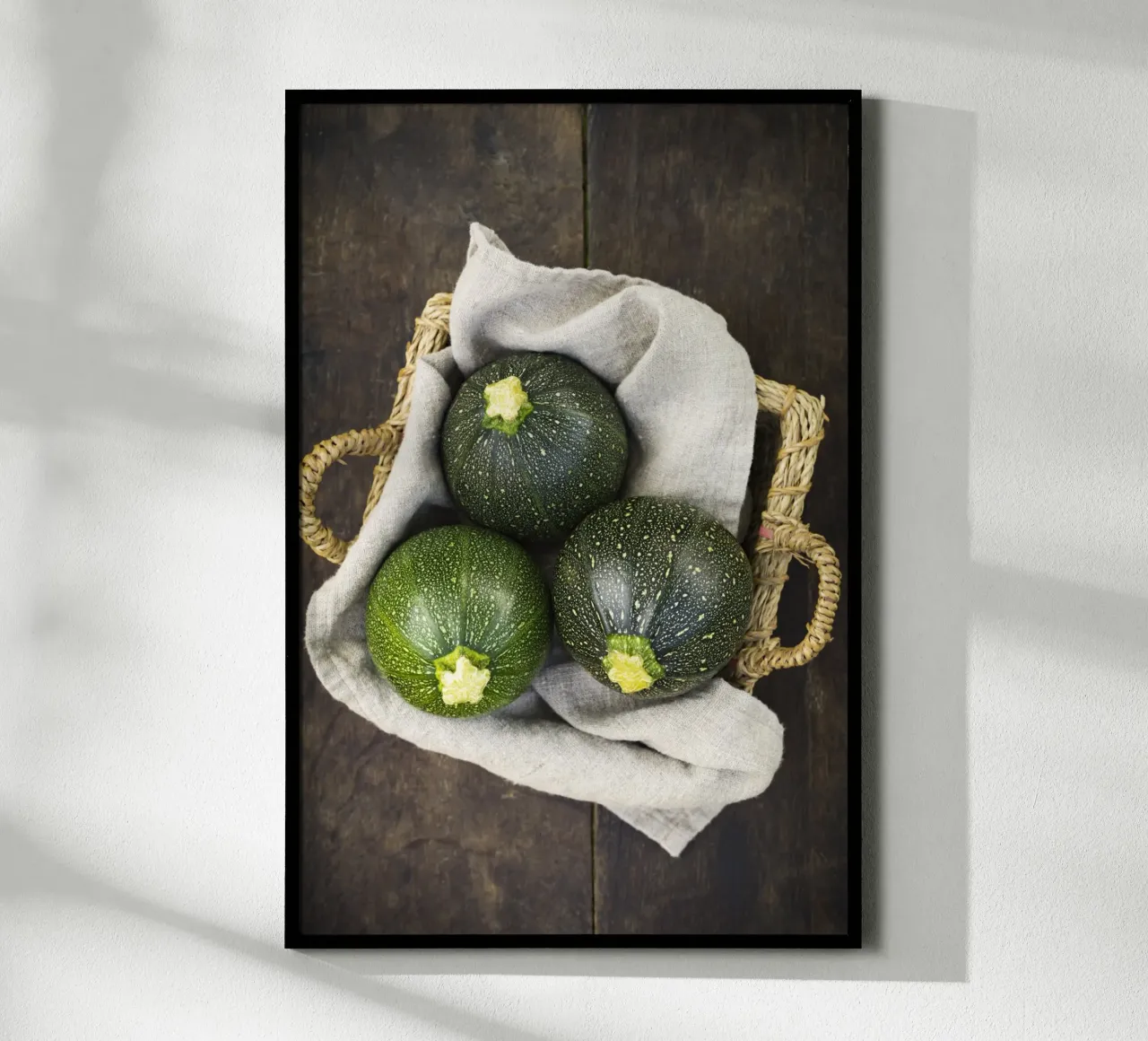 Round courgettes in a wicker basket poster by foodphotolove