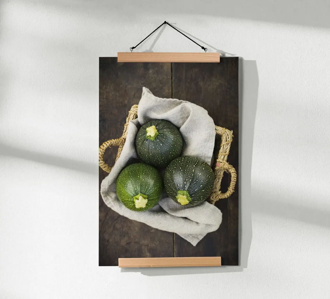 Round courgettes in a wicker basket poster by foodphotolove