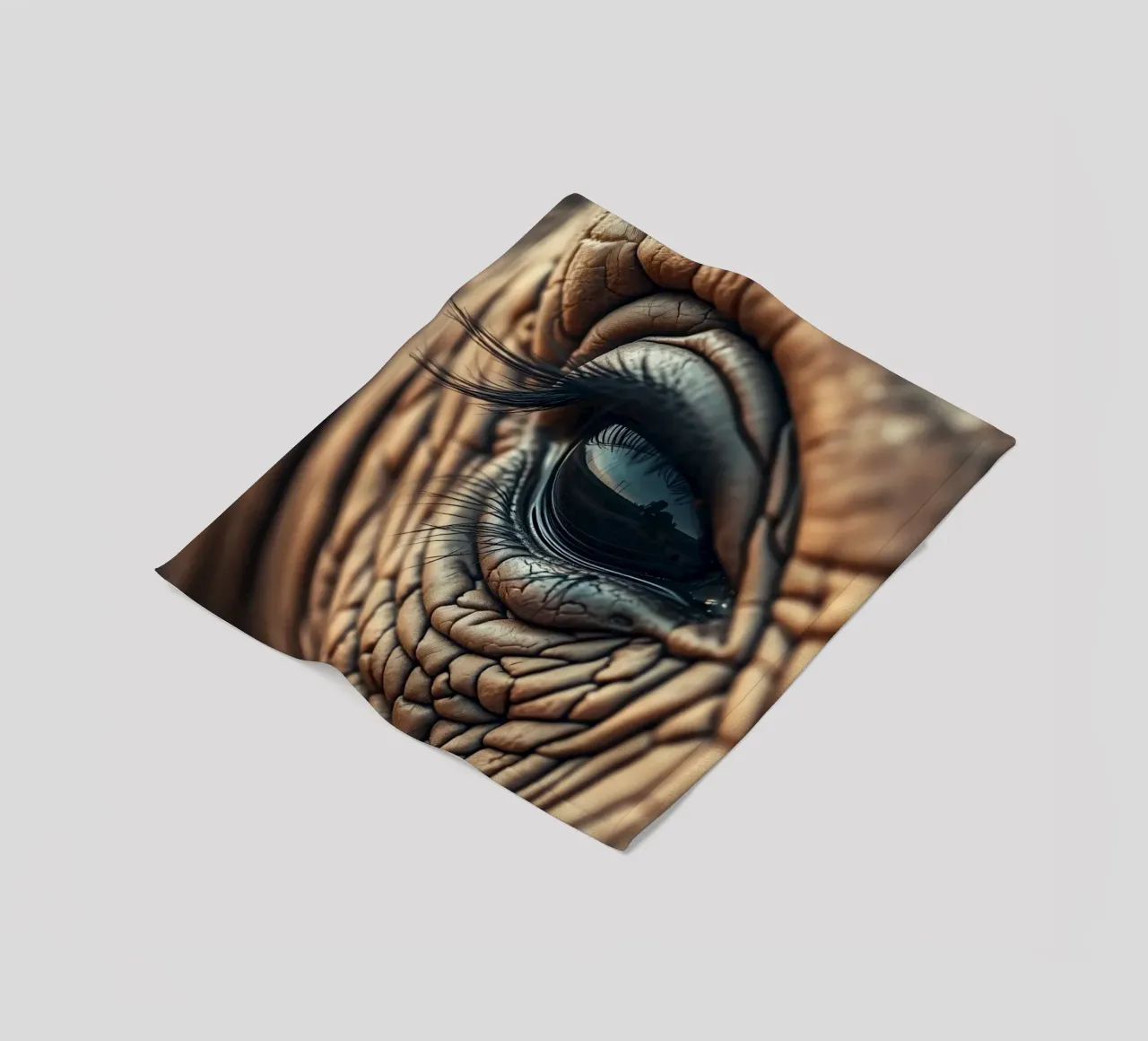 Close-up of an elephant's eye revealing intricate details fleece blanket by DesignDoodle