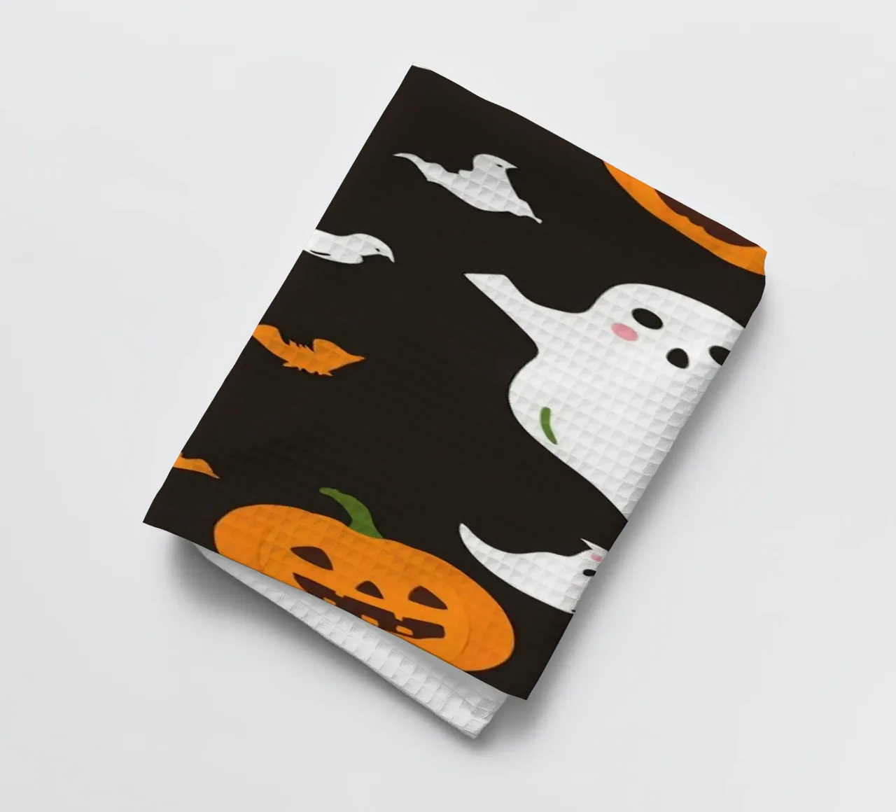 Colorful Halloween-themed playful ghosts and pumpkins tea towel by DesignDoodle