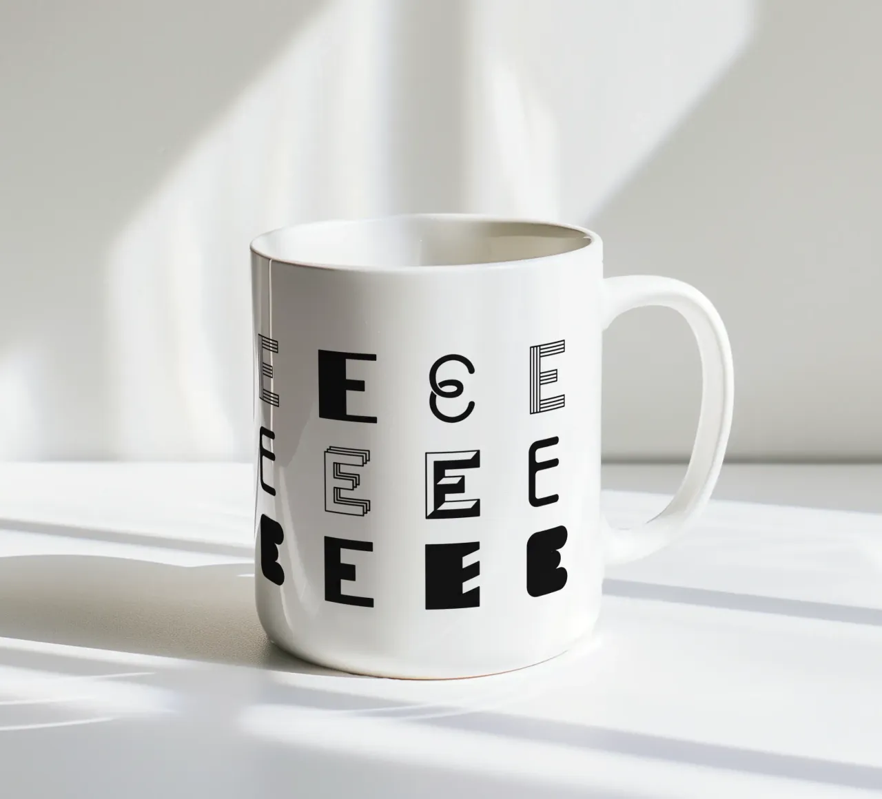 Letter E ceramic mug by Lidia Blomgren