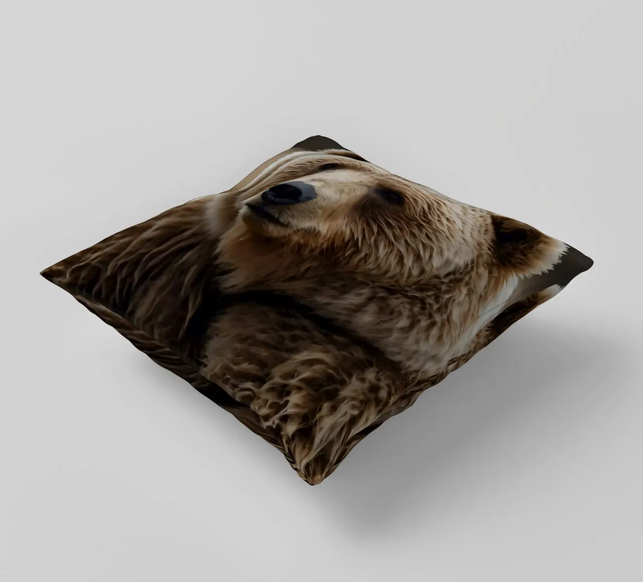 Vue rapprochée d'un ours brun se reposant dans un champ herbeux. coussin de DesignDoodle