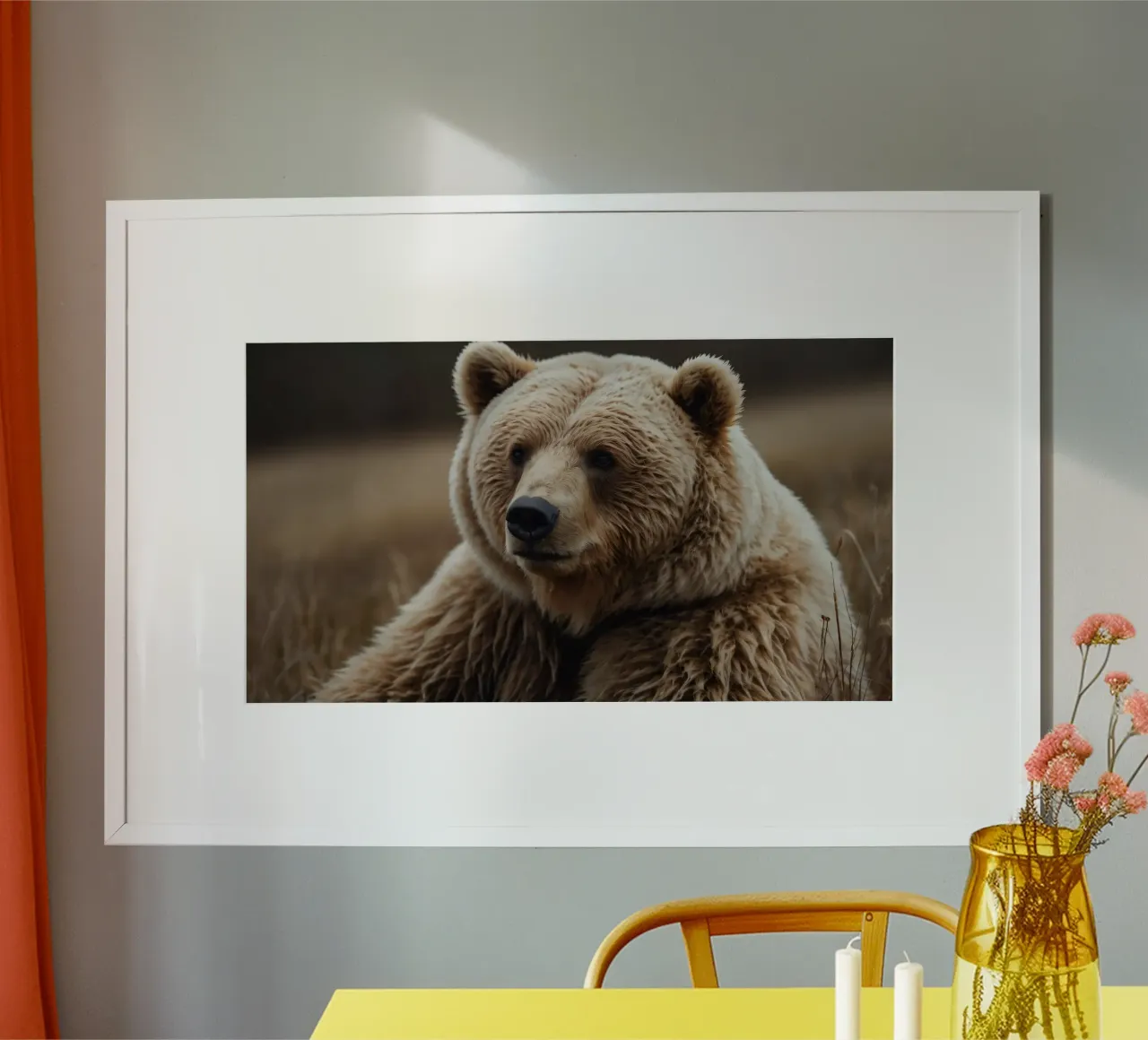A close-up view of a brown bear resting in a grassy field poster with aluminum frame by DesignDoodle