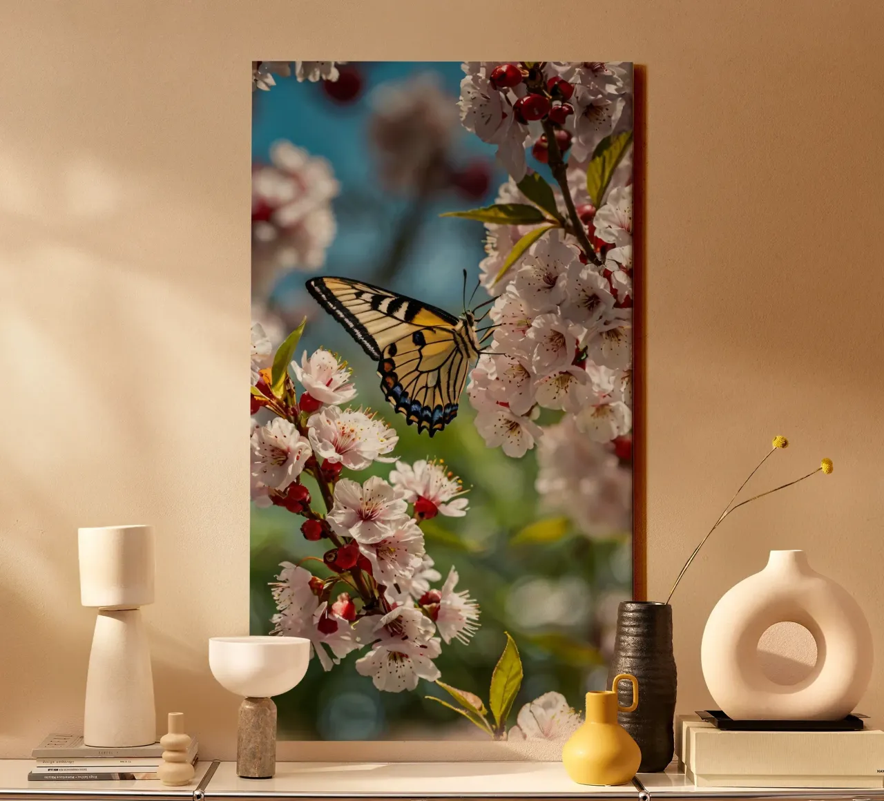 Una farfalla si posa delicatamente sui fiori sbocciati tela da DesignDoodle