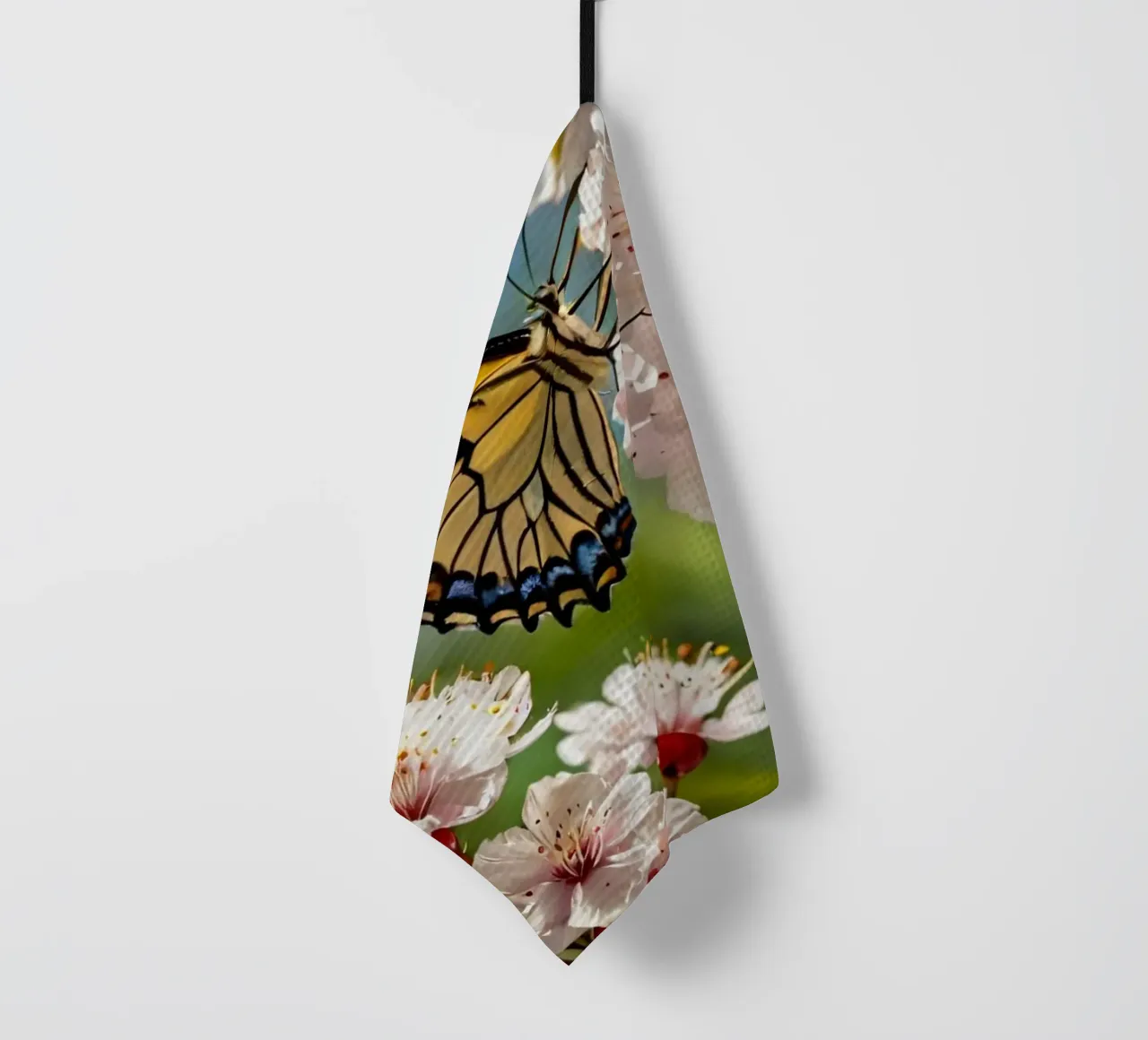 Una farfalla si posa delicatamente sui fiori sbocciati canovaccio da cucina da DesignDoodle