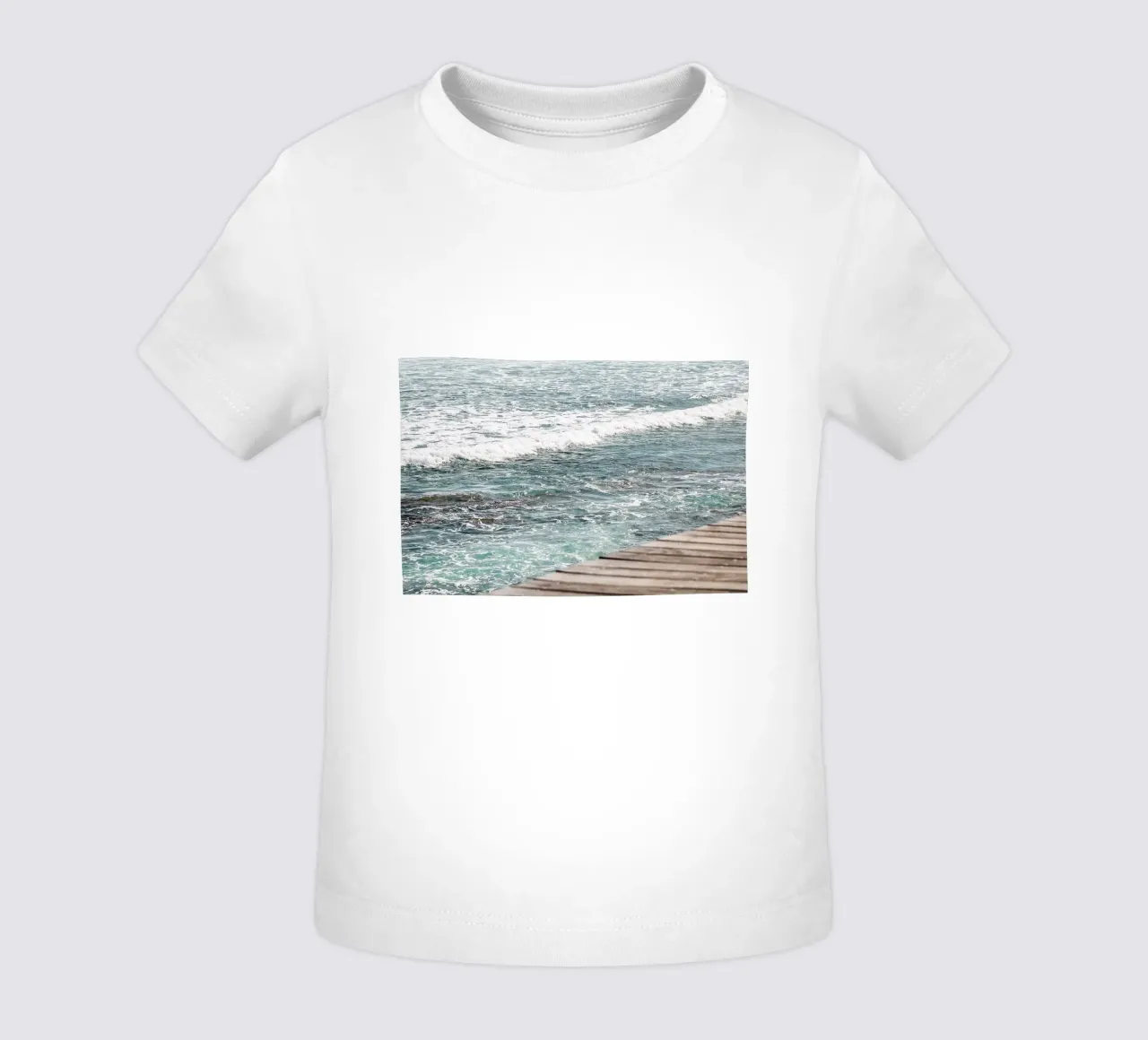 A stroll along the water's edge baby t-shirt by Léa Lefebvre Photography