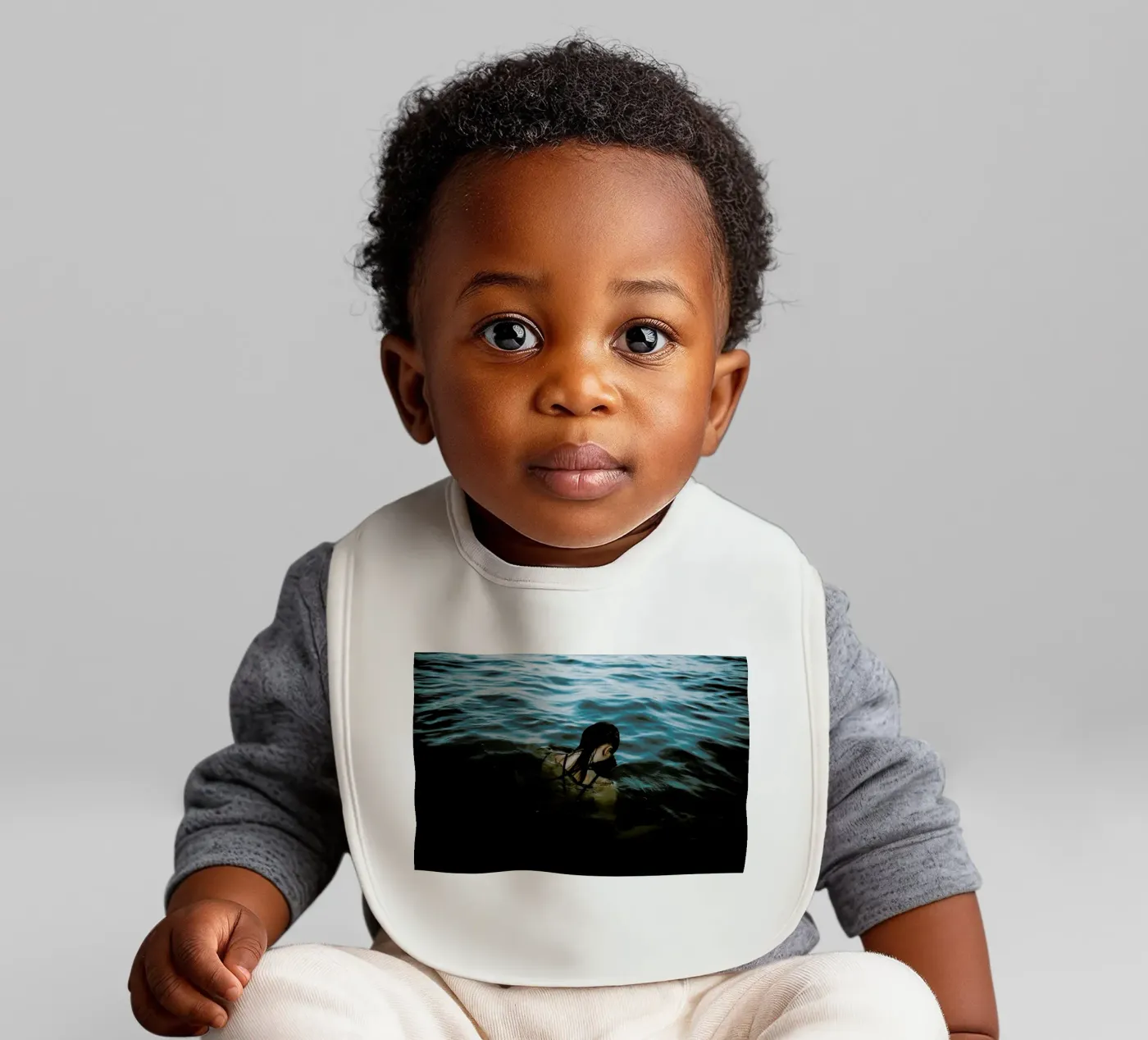 Drowning baby bib by Chris Abatzis