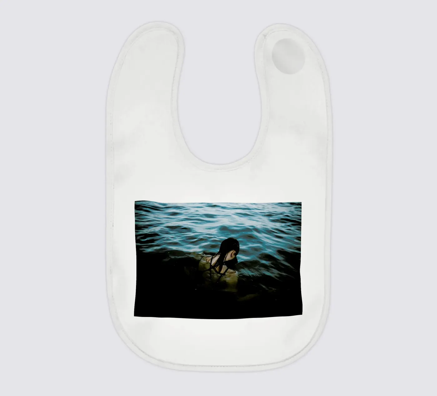 Drowning baby bib by Chris Abatzis
