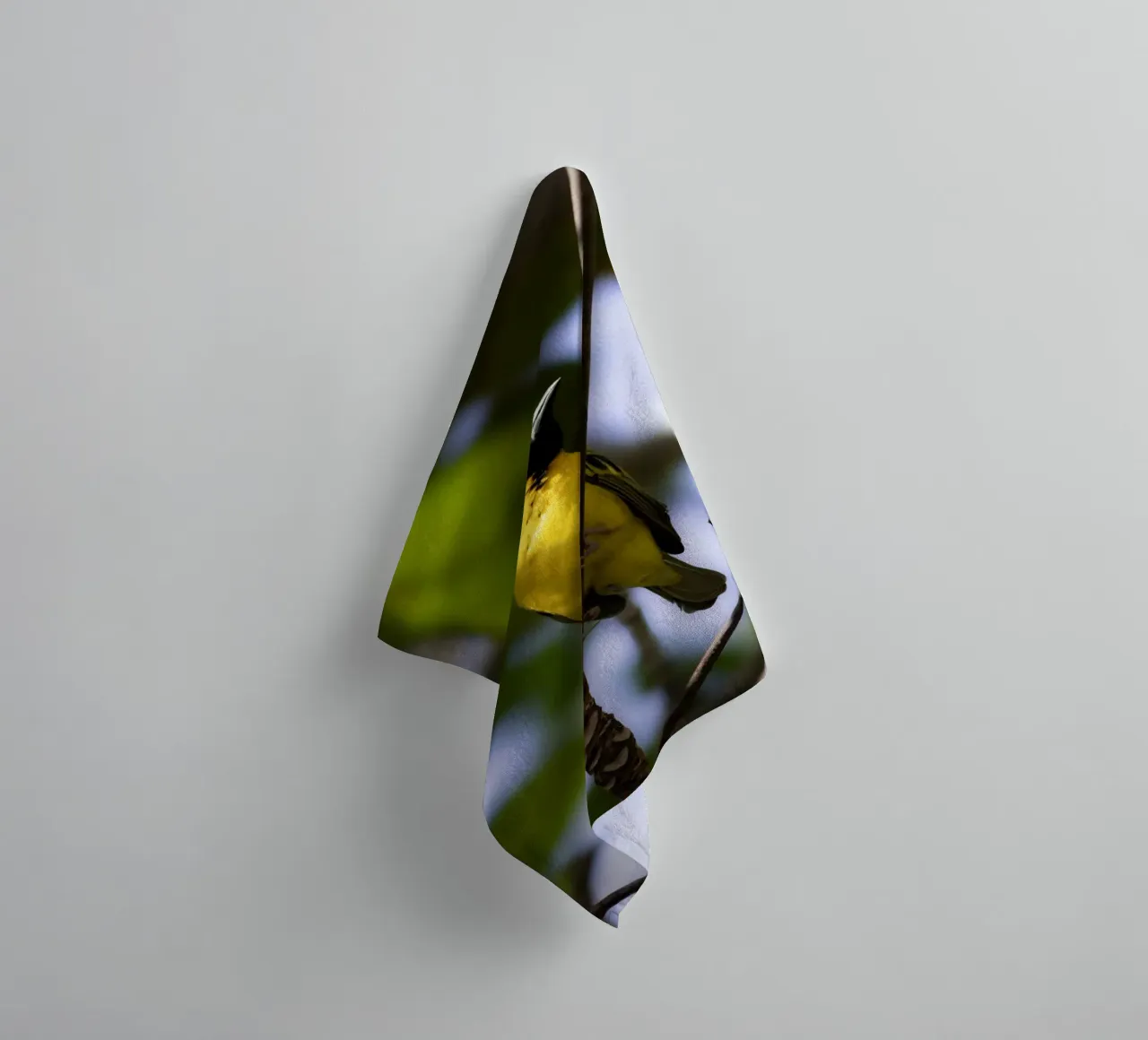 Yellow Bird perched on a branch towel by Léa Lefebvre Photography