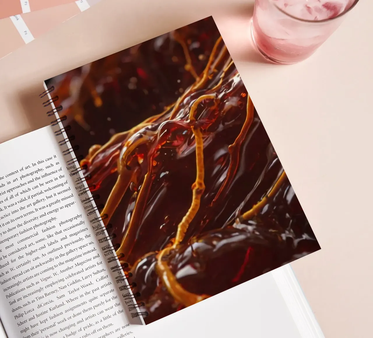 Fluid dynamics captured in orange and red layers spiral notebook by DesignDoodle