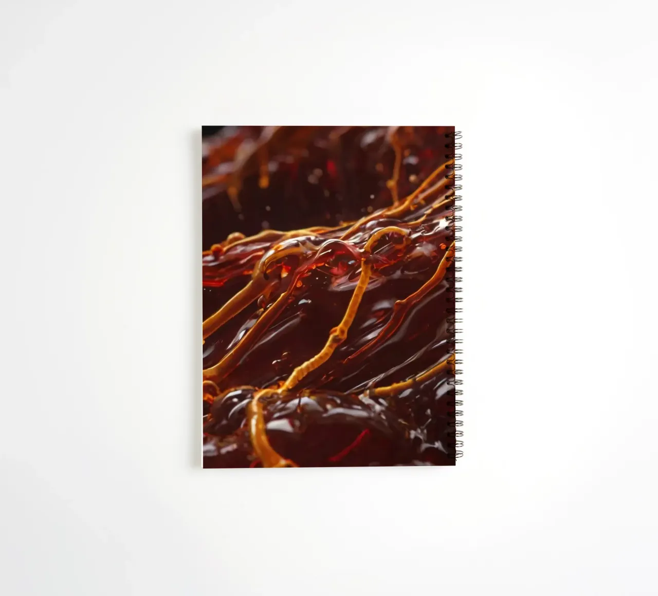 Fluid dynamics captured in orange and red layers spiral notebook by DesignDoodle