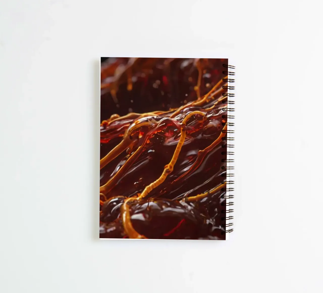 Fluid dynamics captured in orange and red layers spiral notebook by DesignDoodle
