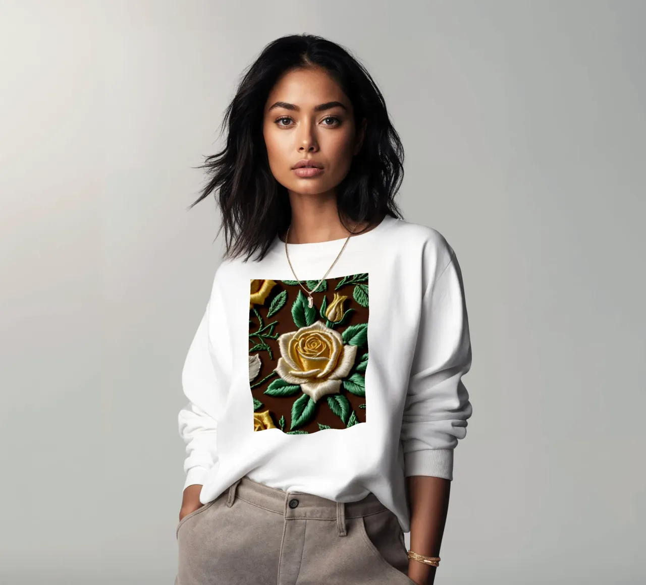 Rose ricamate di ottima fattura su un tessuto marrone felpa da DesignDoodle